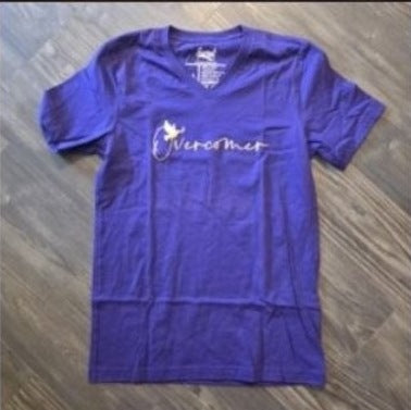 Overcomer Purple V-Neck Tee photographed on wood floor